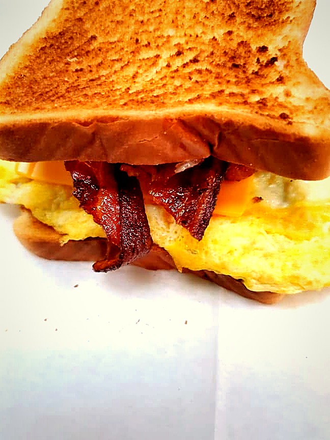 Bacon, egg and cheese breakfast sandwich on toasted bread